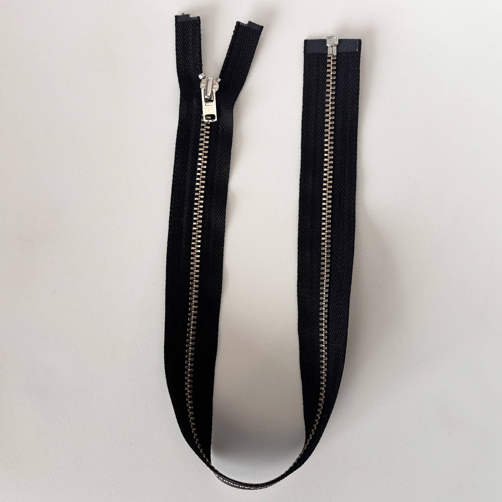 open ended black metal jacket zip