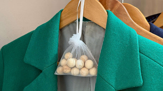 mothballs in a bag hanging up in a wardrobe