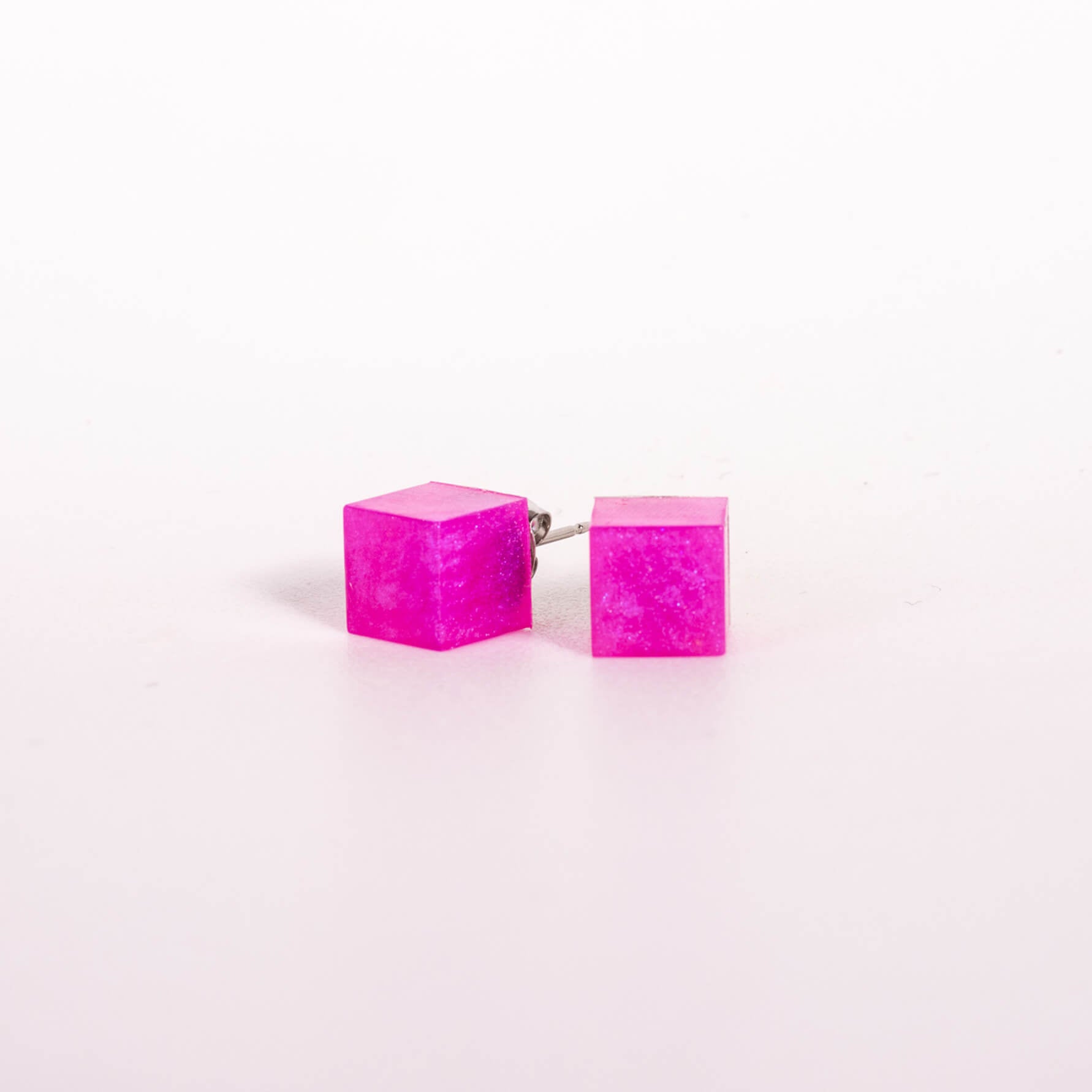 Hot pink resin cube stud earrings from desiree clothing